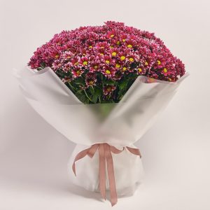 Bouquet of vibrant pink flowers wrapped elegantly, flowers theme